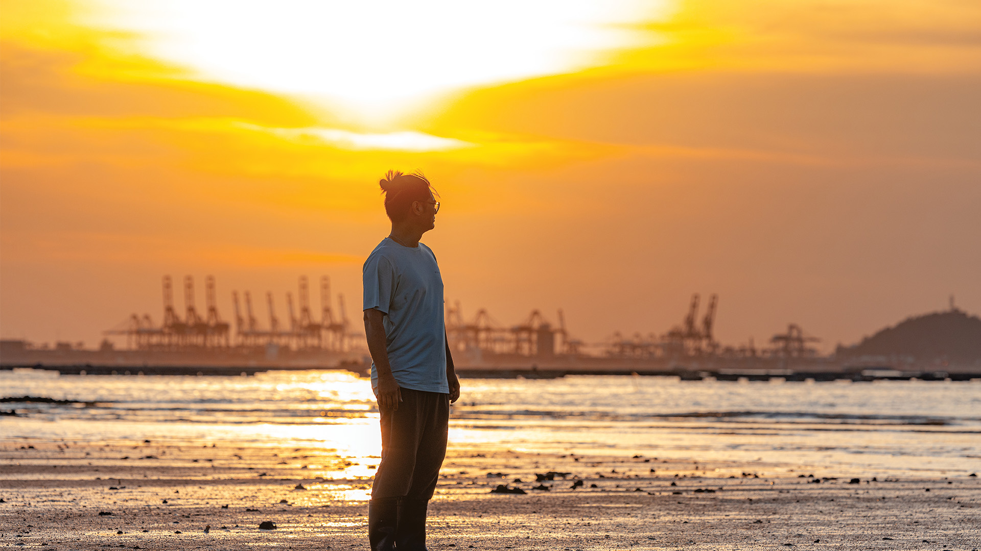 Chan Shu-fung standing amidst the tranquil mudflat